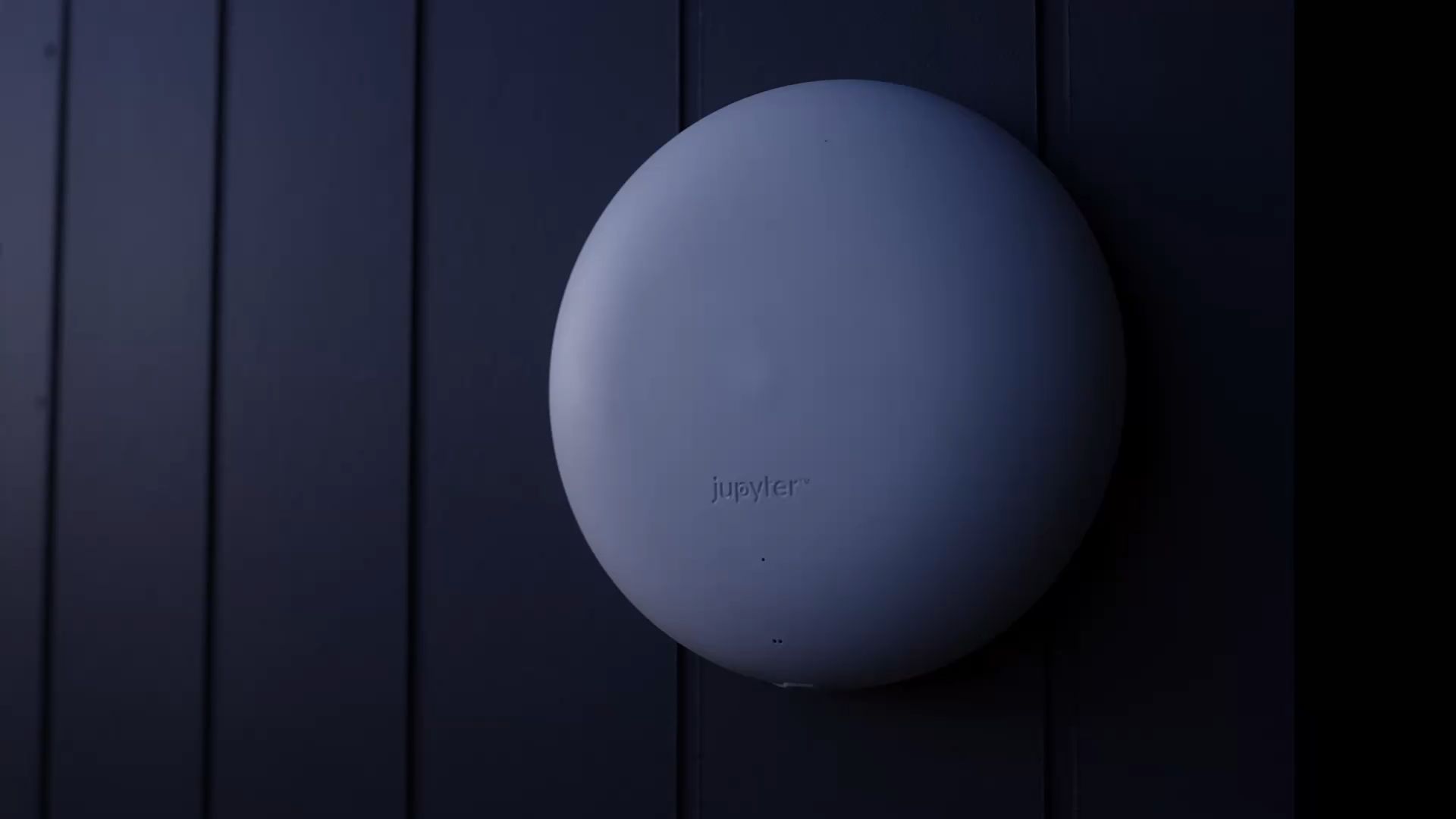 The Outdoor Halo mounted on a dark wall